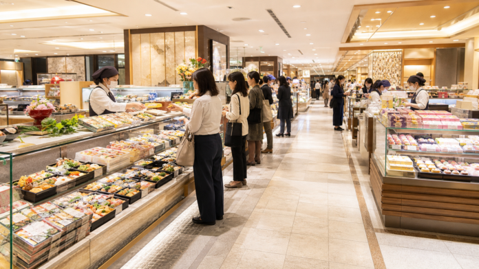 Japanese department-store basement food hall with bento, prepared-food, sushi and sweets counters