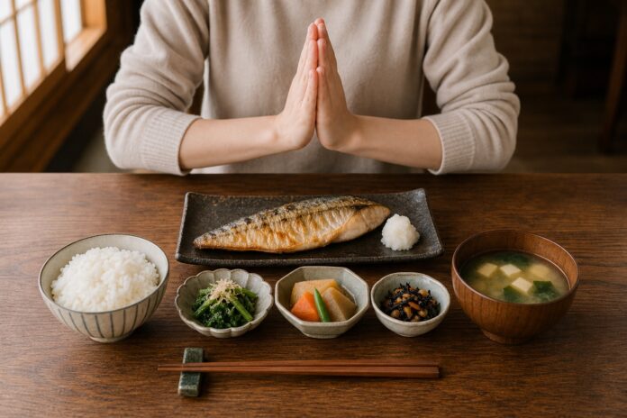 Japanese set meal with chopsticks correctly placed on a chopstick rest