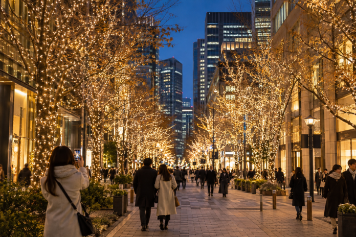 Champagne-gold winter lights along a modern Tokyo boulevard